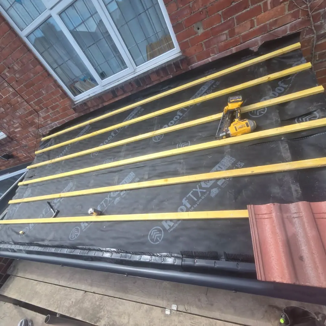 New breathable membrane and treated battens over a rebuilt roof slope