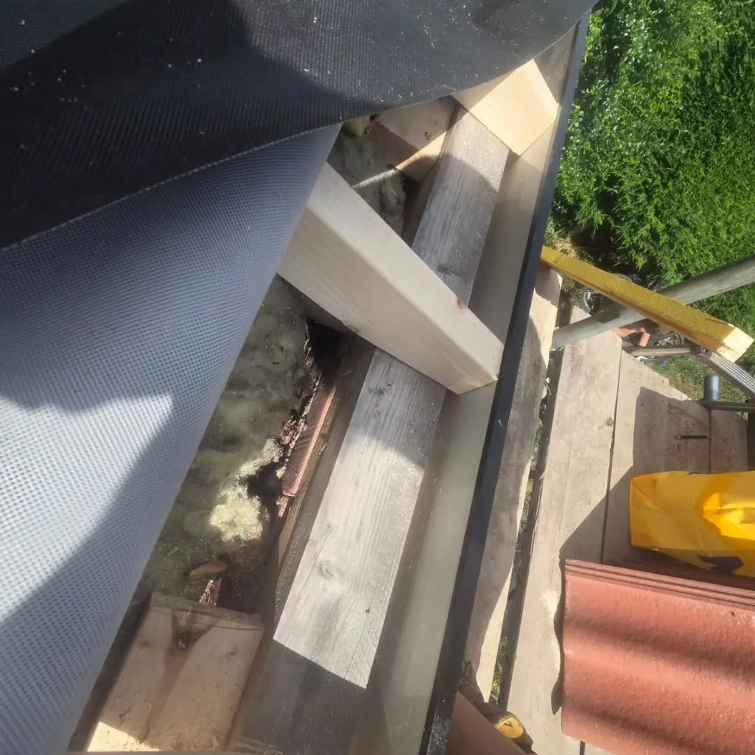 New timber fixed and levelled against the wall, replacing poorly fixed roof timbers