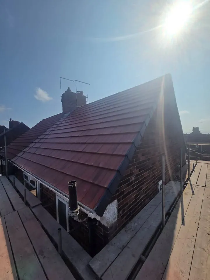 Completed roof replacement in Silksworth showing new plain tiles and dry verge